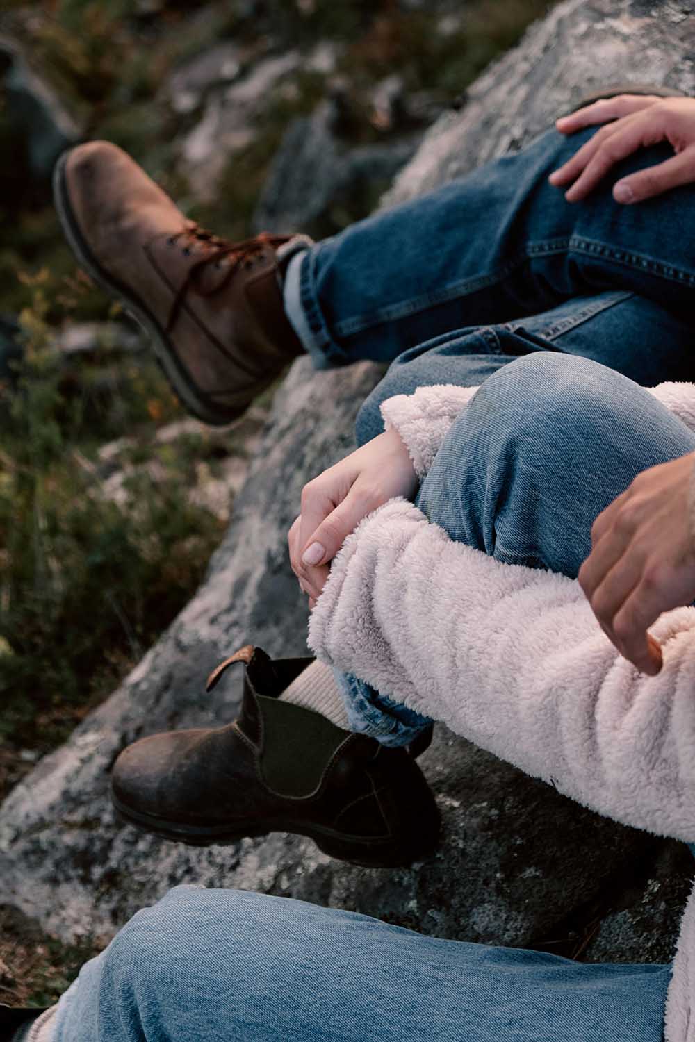 Outdoorsy couple sitting together outside