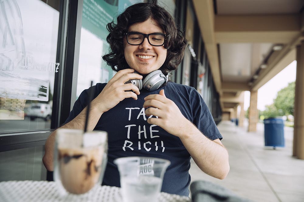 Geeky man at a coffee shop