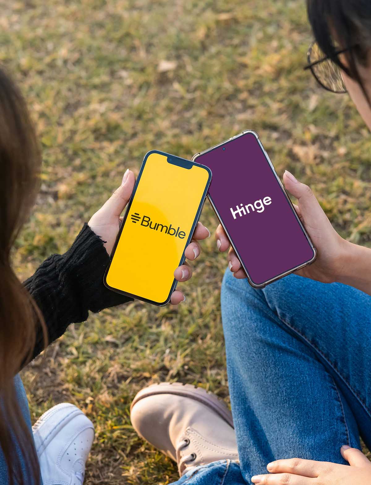 Two girls looking at dating websites on a phone