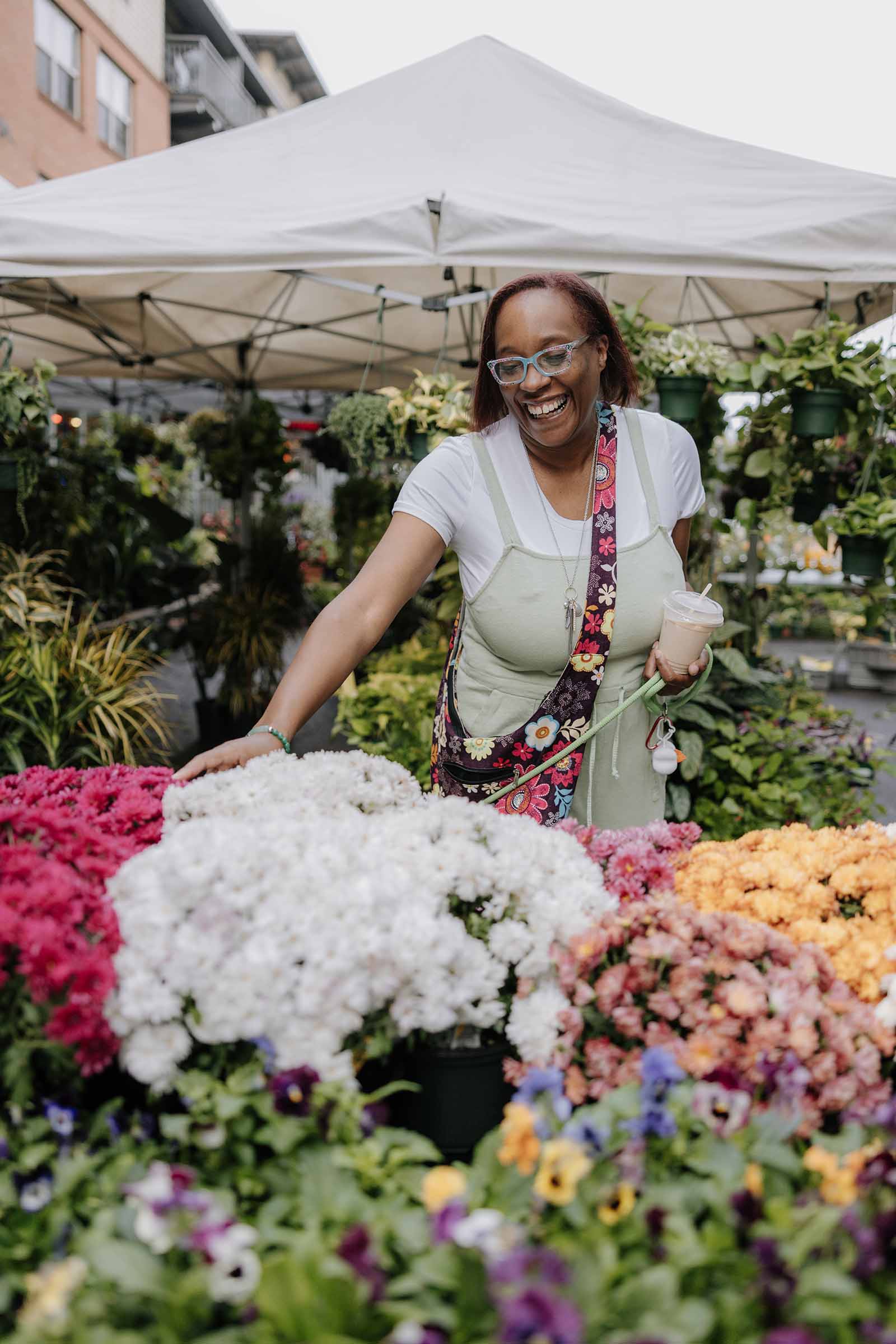 Woman smiling at a flower market